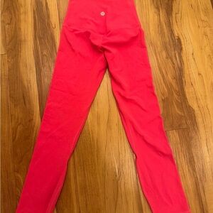 Bright Pink High-Waisted Lulu Lemon Align leggings.